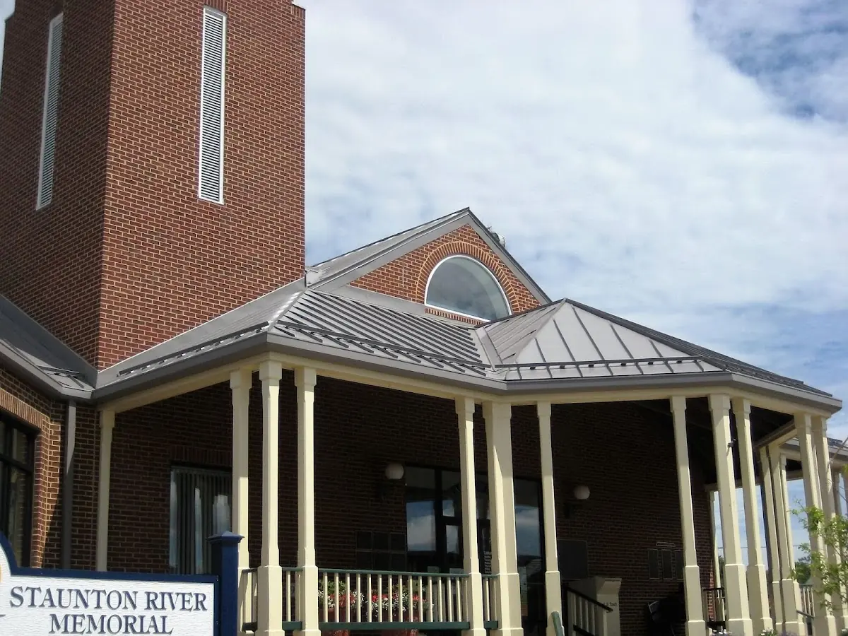 Skilled roofing craftsmen working on a residential roof in Benton Harbor